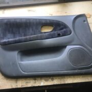 Обшивка двери передней левой (дверная карта) для Mitsubishi Lancer 7