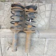 Стойка передняя левая для Mitsubishi Lancer 7