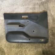 Обшивка двери передней левой (дверная карта) для Ford Escort 5