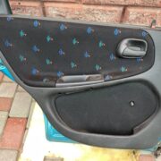 Обшивка двери задней левой (дверная карта) для Opel Astra F