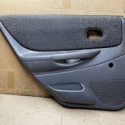 Обшивка двери задней левой (дверная карта) для Mazda 323 BJ